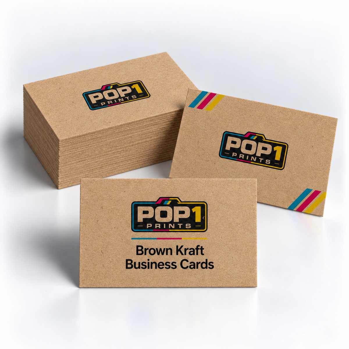 Brown kraft business cards with POP 1 Prints branding and colourful corner stripes, displayed beside a stack.